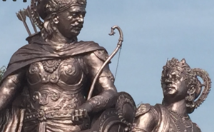 Image of a statue depicting Krishna counciling the warrior Arjuna 